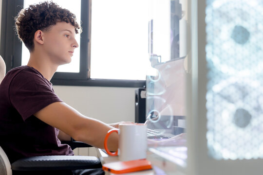 Young man using AI tools on gaming computer