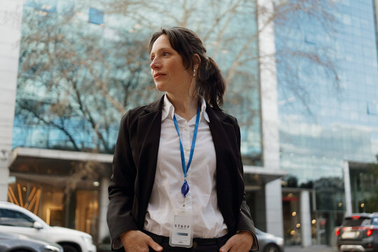 Business Woman Standing Outside a Modern Building During the Day