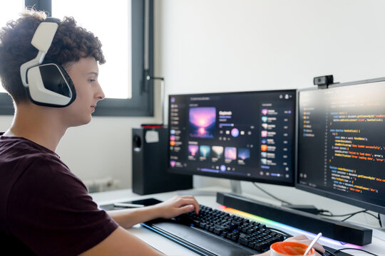 Young man use AI tools on gaming computer at desk