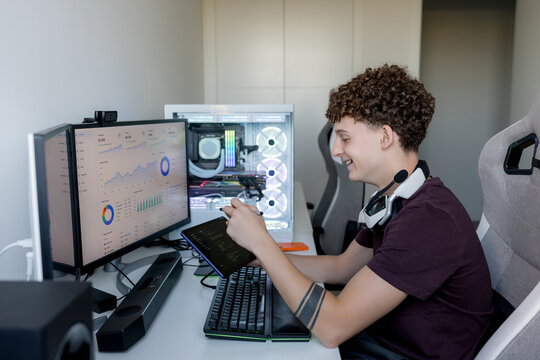 Young man using AI tools on gaming computer