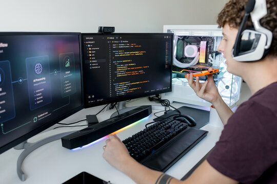 Young man using AI tools on gaming computer