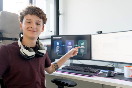 Young man point at AI tools on gaming computer