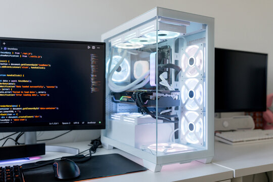 Young man workstation with gaming computer and AI tools