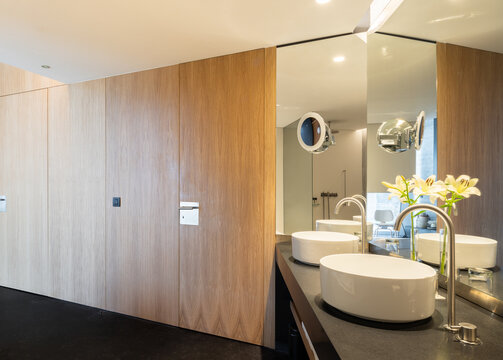 Luxury villa bathroom with double basin and mirror wall
