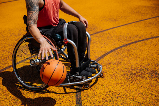 Wheelchair Basketball Athlete Playing On Outdoor Court