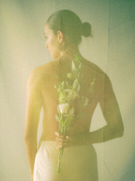 Woman with Flowers Behind Her Back