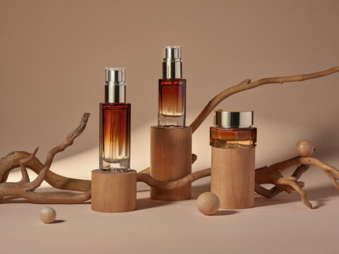 Perfume bottles displayed on wooden pedestals with natural elements