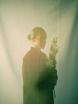Woman Looking at Flowers