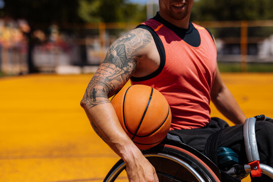 Wheelchair Basketball Athlete With Tattoo On Outdoor Court