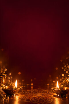 Minimal vertical Diwali background with two glowing brass diyas, rich burgundy tones, soft golden bokeh and generous clean space for elegant advertising design.