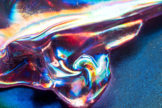 Iridescent crumpled foil texture with vivid abstract colors