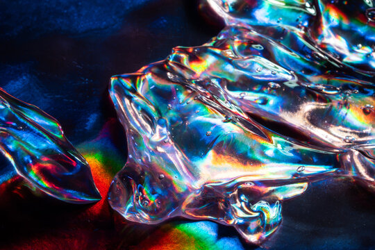 Iridescent ice crystal on dark abstract background