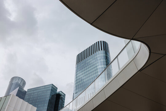 Modern Glass Towers Framed by Curved Architecture