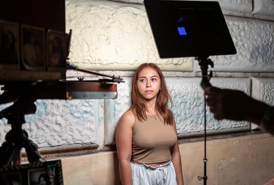 Young woman pose for analog photography in urban studio