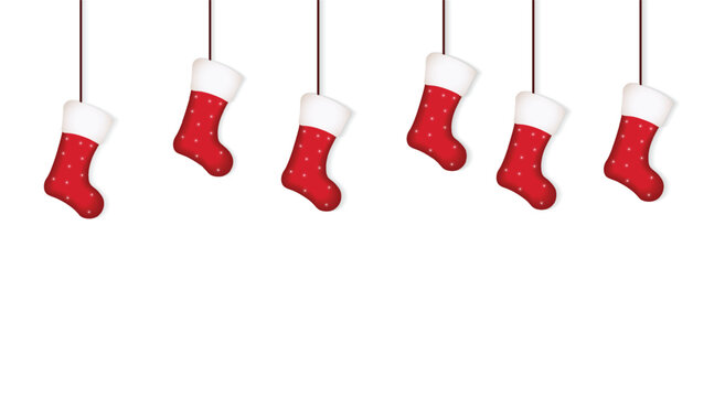 Red Christmas shocks Hanging From Decorative Strings On Clean White Background