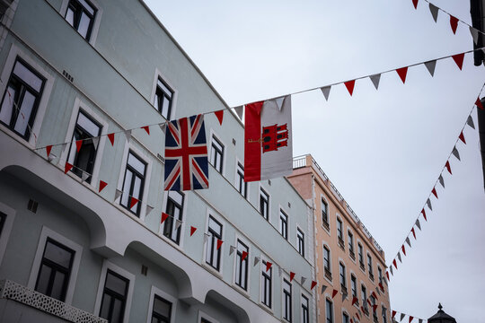 Gibraltar flags and bunting above a European street