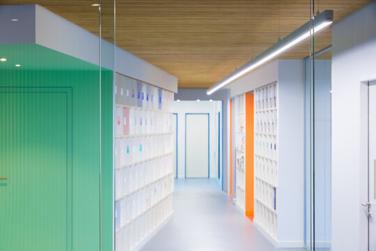 Modern coworking office corridor with glass partitions