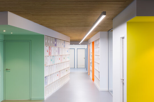 Colorful corridor with lockers in modern coworking office