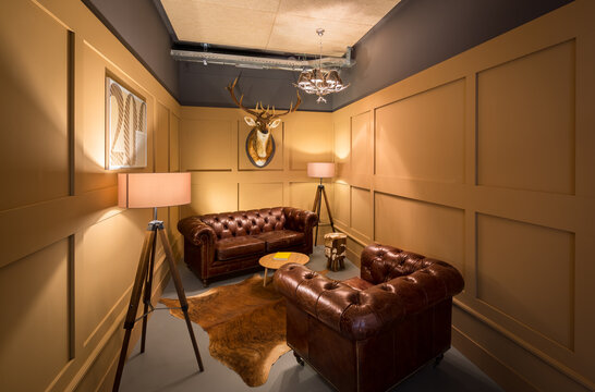 Elegant coworking lounge with leather sofa and armchair