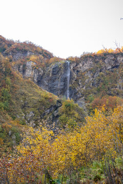 Polikarya waterfall in autumn, Krasnaya Polyana, Sochi, Russia