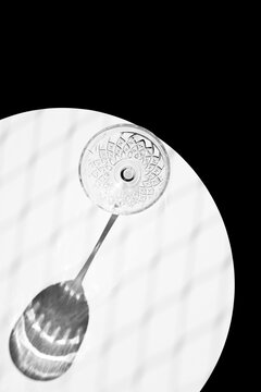 Empty cocktail glass on marble table in studio