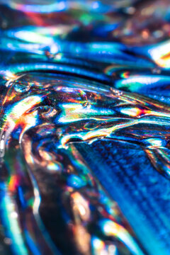 Iridescent liquid surface with abstract science background