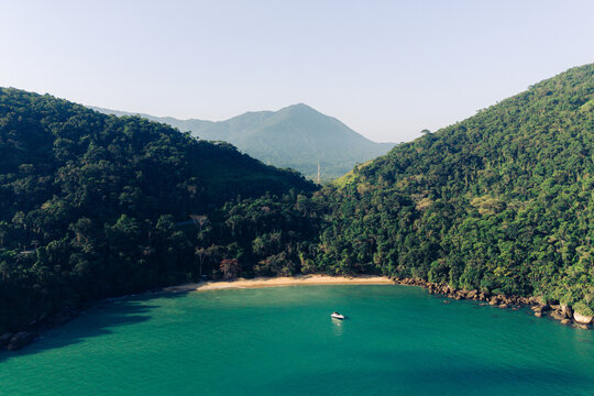 Aerial view of secluded beach and forested bay in Ubatuba