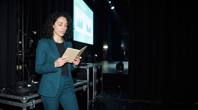 Speaker running through her notes backstage before going on