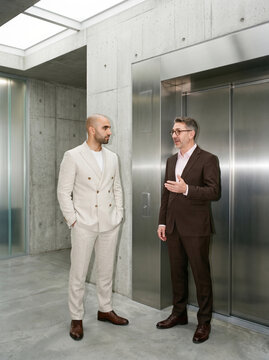Executives discuss business in a modern concrete office
