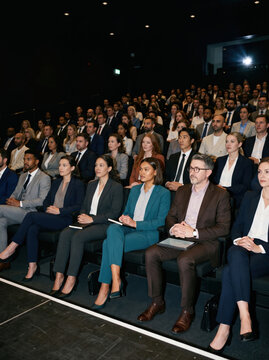 Executive audience at a formal business conference event