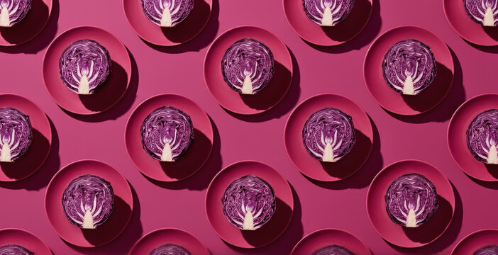 Surreal red cabbage pattern on magenta plate background
