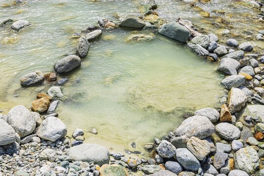Boulders form a circle in the mountain stream La Navisence, near Zinal, Val d'Anniviers, Valais Alps, Canton Valais, Switzerland