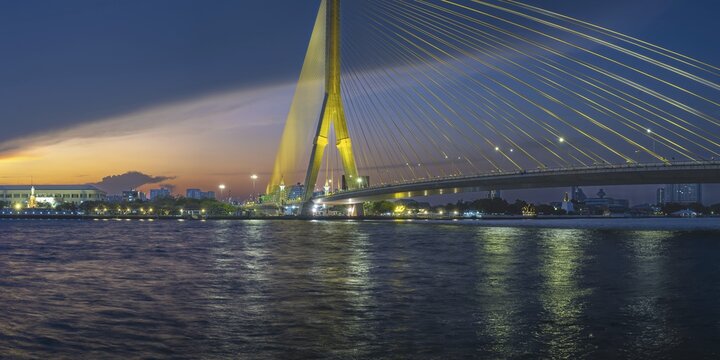The illuminated Rama VIII bridge over Mae Nam Chao Praya, Bangkok, Thailand