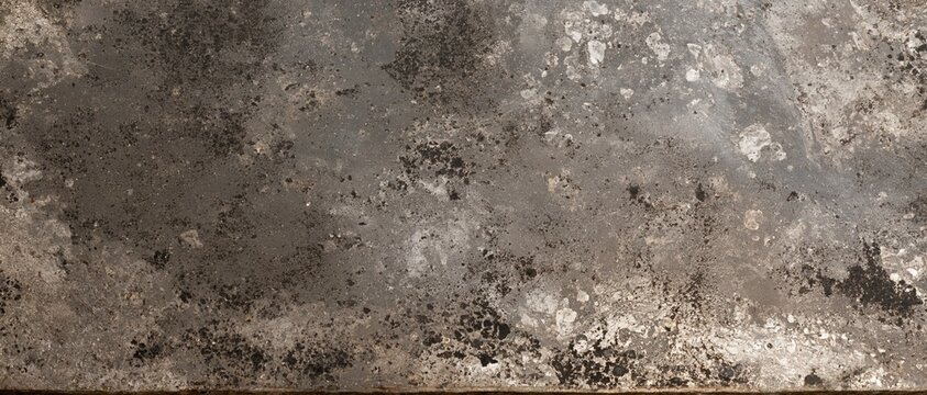 Silver patina on an antique mirror surface with a weathered, mottled texture and dark speckles for vintage backgrounds and overlays