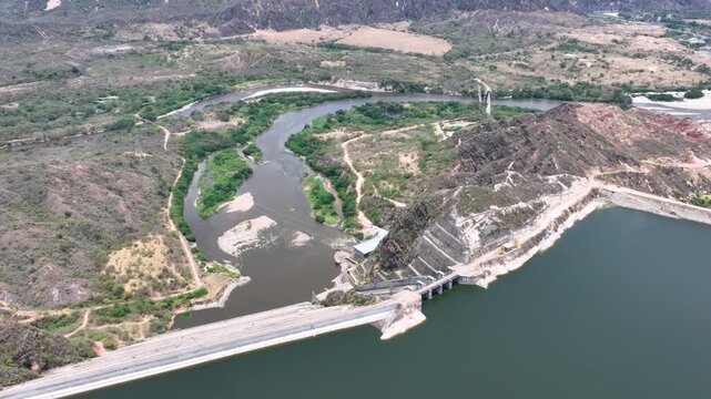 El Quimbo Dam Engineering and Hydroelectric Energy Infrastructure on the Magdalena River in Colombia. Establishing Shot. Aerial View.