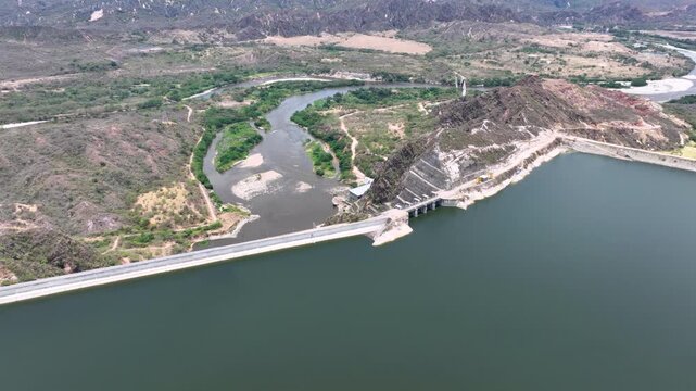 El Quimbo Dam Engineering and Hydroelectric Energy Infrastructure on the Magdalena River in Colombia. Establishing Shot. Aerial View.