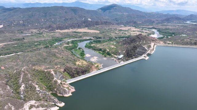 Expansive El Quimbo Hydroelectric Reservoir and Mountain Landscape in Huila, Colombia. Establishing Shot. Aerial View.