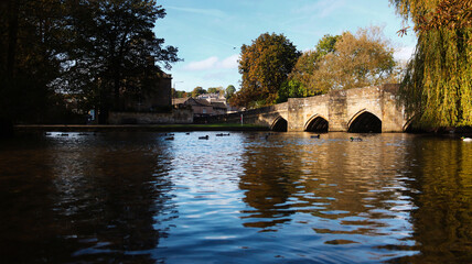 Fototapeta premium Old stone bridge over a river in the Peak District