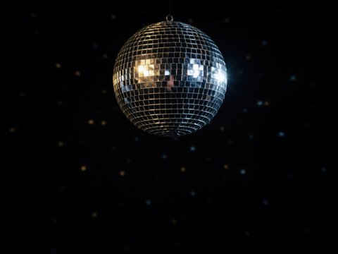 Retro mirror disco ball shining on black background, silver mirrorball reflecting light for party night, festive club decoration