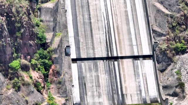 El Quimbo Dam with Hydroelectric Infrastructure and Large Reservoir on the Magdalena River, Colombia. Establishing Shot. Aerial View.