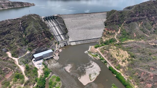 El Quimbo Hydroelectric Dam and Reservoir on the Magdalena River in Huila, Colombia. Establishing Shot. Aerial View.