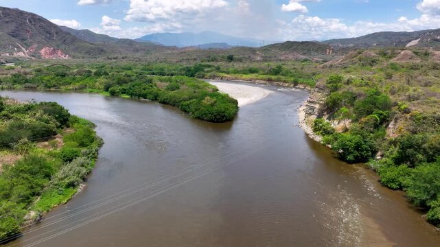 El Quimbo Hydroelectric Dam and Reservoir on the Magdalena River in Huila, Colombia. Establishing Shot. Aerial View.
