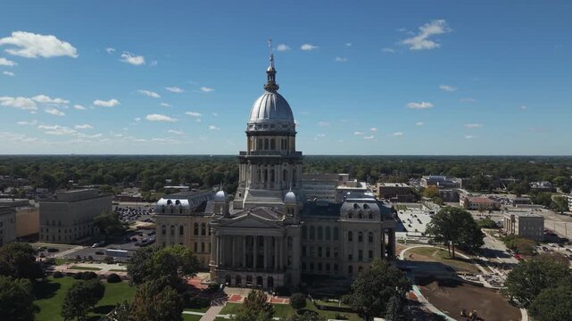 Illinois State Capitol drone shot - the drone is backlit by the sun