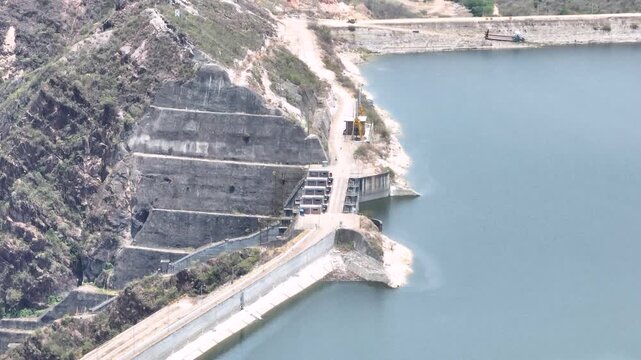 Expansive El Quimbo Hydroelectric Reservoir and Mountain Landscape in Huila, Colombia. Establishing Shot. Aerial View.