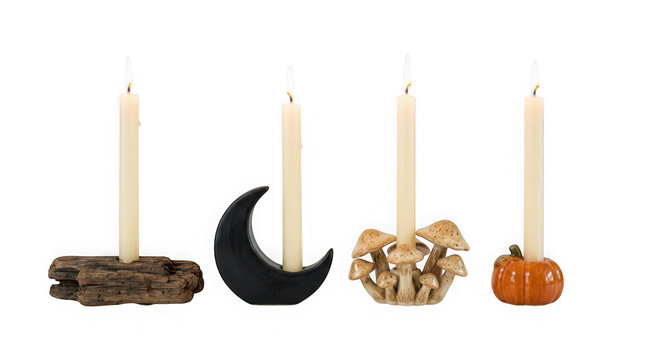 Set of four unique decorative candle holders with taper candles isolated on transparent background