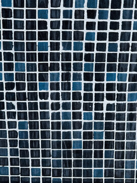 Blue and black square mosaic tiles with white grout lines