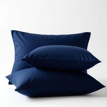 Set of three navy blue pillowcases made of soft cotton jersey fabric. Minimalist bedding decor with hidden zipper detail for modern bedroom. Comfortable textile cushions for restful sleep, home
