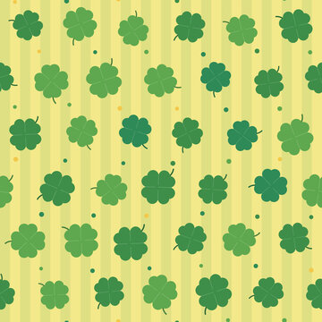 Four leaf clover lucky shamrock with striped background seamless pattern on pale gold background