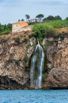 Maro waterfall flowing into the Mediterranean Sea in the Maro-Cerro Gordo natural area