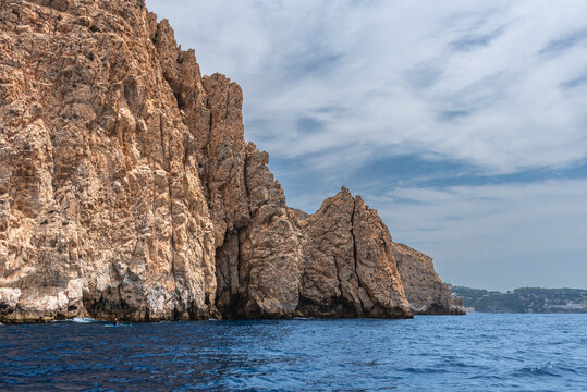 Huge vertical cliff rising from the sea in the Maro-Cerro Gordo natural area, Andalusia, Spain
